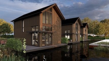 Toekomstige bewoners Drie Watermeesters aan tafel bij architect